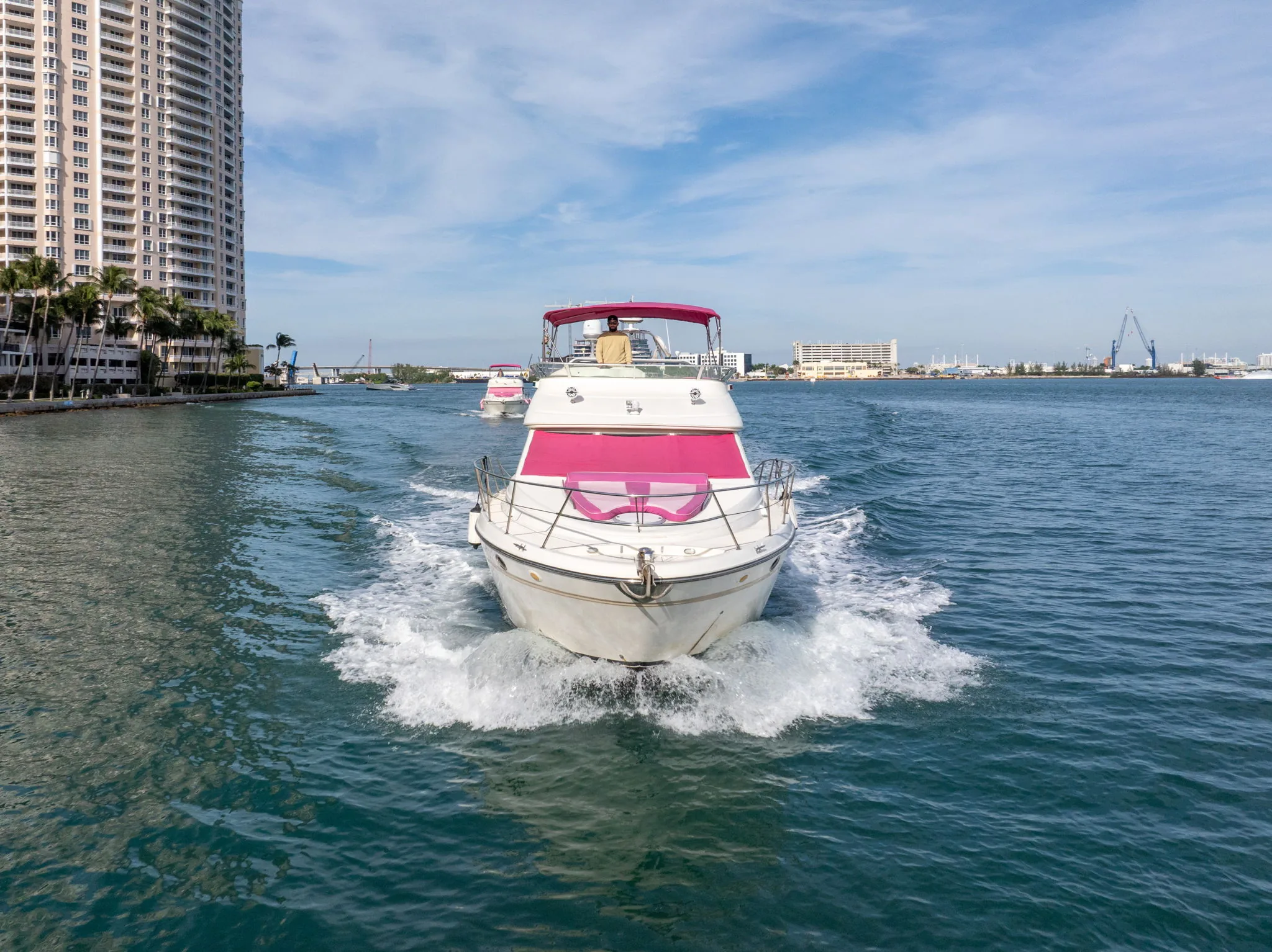 54' Bad Bunny pink Miami yacht underway on Biscayne Bay